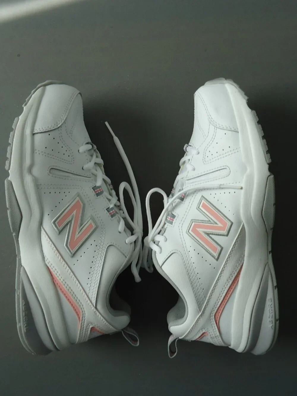 SIZE 9.5. D. New Balance women's white leather sneakers shoes.
